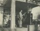 CLARK, Roy Allen (1884-1963)- Servicing a customer at his gas station in Burt, Kossuth, IA, USA.